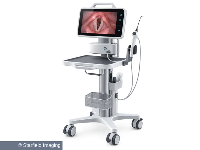 A clinical video cart with a monitor, tray and endoscope.